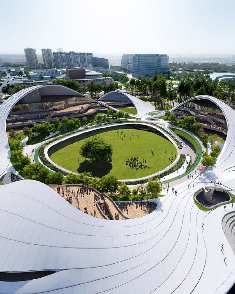 An aerial perspective of the Jiaxing Civic Center, showcasing the elegant white terracotta roof and the integration of natural materials in the design.